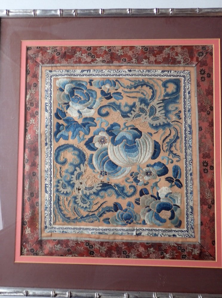 Chinese Framed Floral Embroidery: Blue and White Floral Design in Silver Colored Simulated Bamboo Design Frame. Frame 19 1/2" x 18".