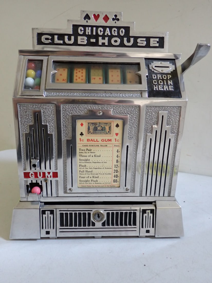 Chicago Club-House Trade Stimulator by Davis Manufacturing Co.: Cast aluminum metal case with Chicago Club-House crest piece, level on right side, 5 reel poker slot displays with coin slot and gumball display on left side with keys. 15 1/2" high. Art Deco Design. 