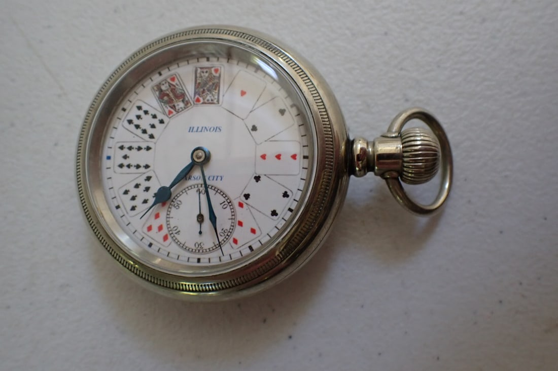 Illinois Pocketwatch in Silver Case Playing card design with fob: Illinois Carson City on dial. Numbered 0559 Watch runs- case didn't open