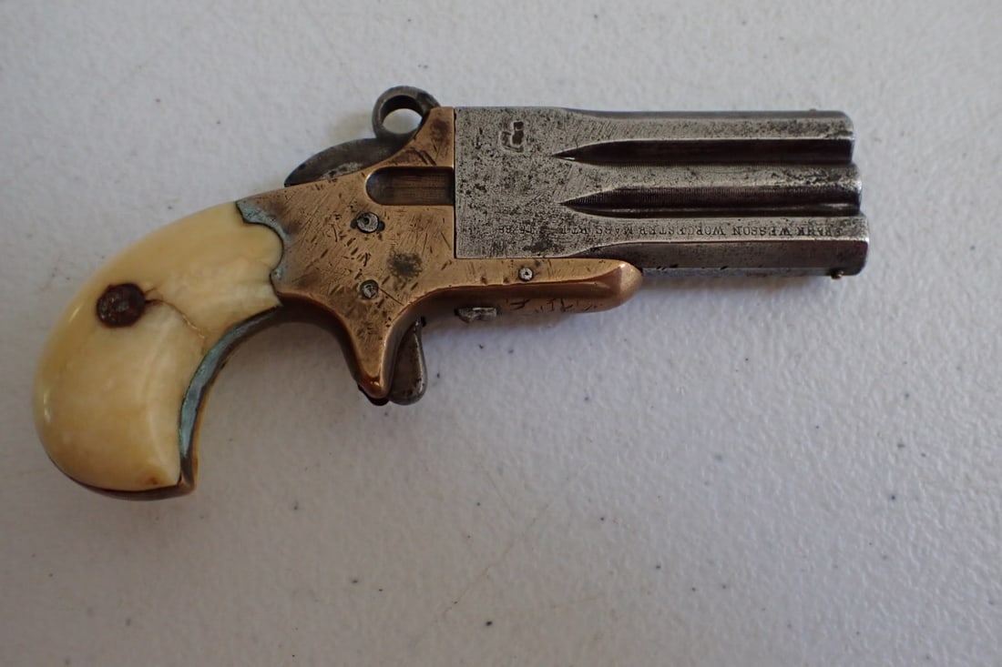 Frank Wesson Worcester, Mass Parlor Pistol: Marked Frank Wesson, Worcester, Mass. Parlor Pistol. Serial # 2460. Ptd date Dec. (the rest unreadable) Has some wear crack on each side of grip. Untested. 4" long
