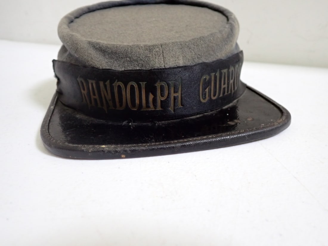 Randolph Guards Confederate Civil War Kepi: Inside is labeled "J.G. Minder Calvert Street, Baltimore" Has "7" which must be the size. Has band that says "Randolph Guard." Has loss of wool and discoloration of wool. Some wear inside and visor is