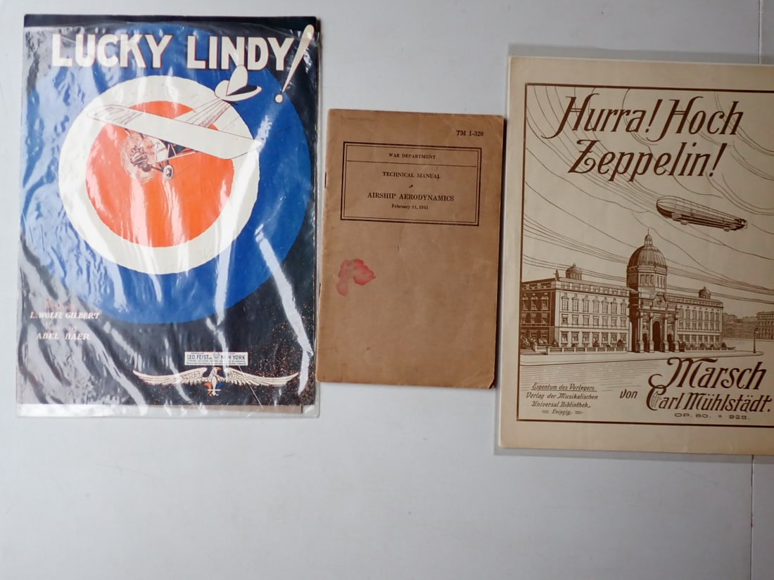 1941 War Department Airship Aerdodynamics Book & Sheet Music: TM 1-320 February 11, 1941 Airship Aerodynamics. Shows some wear with stain and some creasing. Hurra! Hoch Zeppelin! Sheet music and Lucky Lindy sheet music. Have a little wear with person's name prin