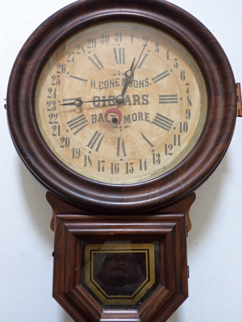H. Cone & Sons Cigars Baltimore Advertisement 31 Day Regulator Clock Reverse painted: 31 Day Regulator Advertisement Clock.E. Ingram & Co. Bristol Connecticut. Grain painted case with Gold leaf paint on lower glass. 24" High 16" diameter. No Pendulum, weights or key. Paper label shows