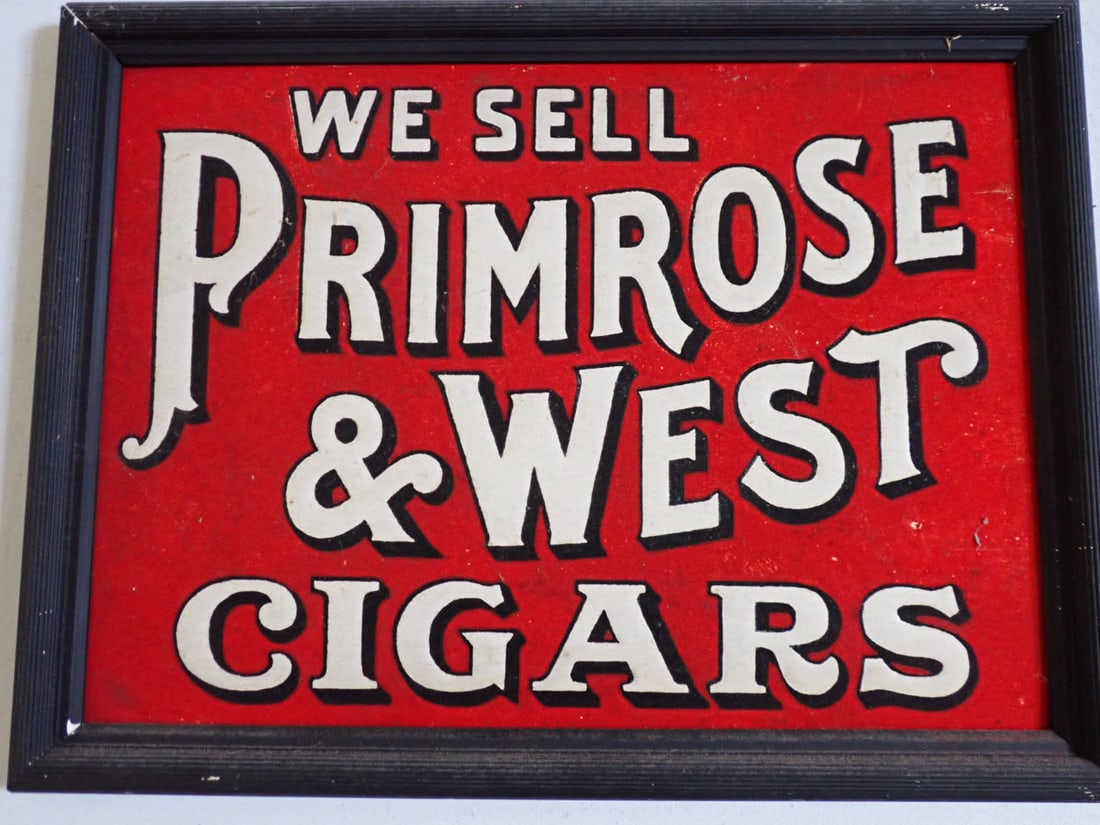 "We Sell Primrose & West Cigars" Advertising sign in Wood frame: Vibrant Colors Advertising cardboard sign "We Sell Primrose & West Cigars" in frame: 12 1/2" x 16 1/2". Sign: 11" x 15" Some minor scuffing, but overall good condition.