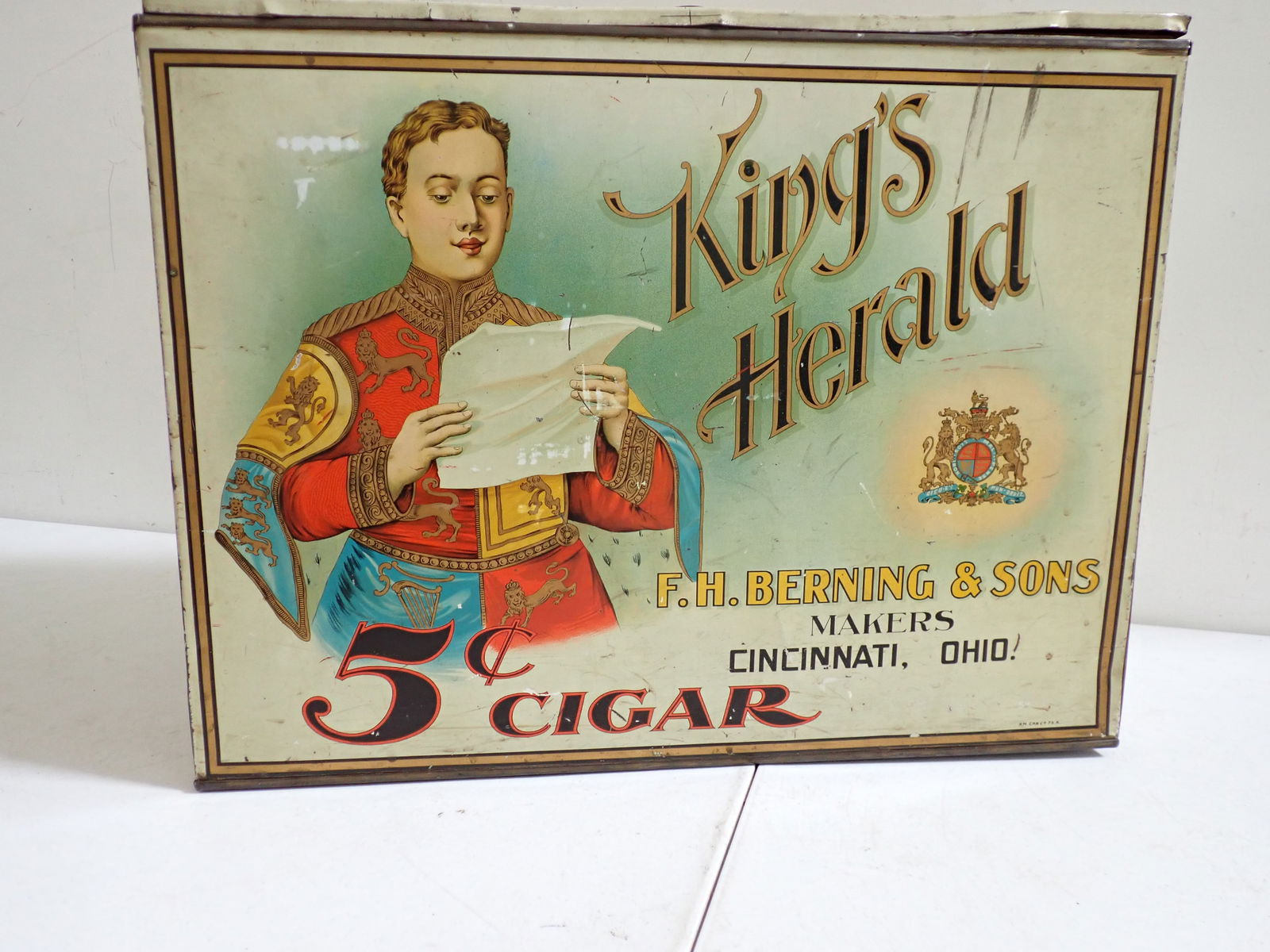 King's Herald $5 Cigar F.H. Berning & Sons Cincinnati Tobacco Tin: Always Fresh King's Herald 5¢ Cigar 15" high x 19 1/2" wide x 10". Some denting and scratches but overall good condition.