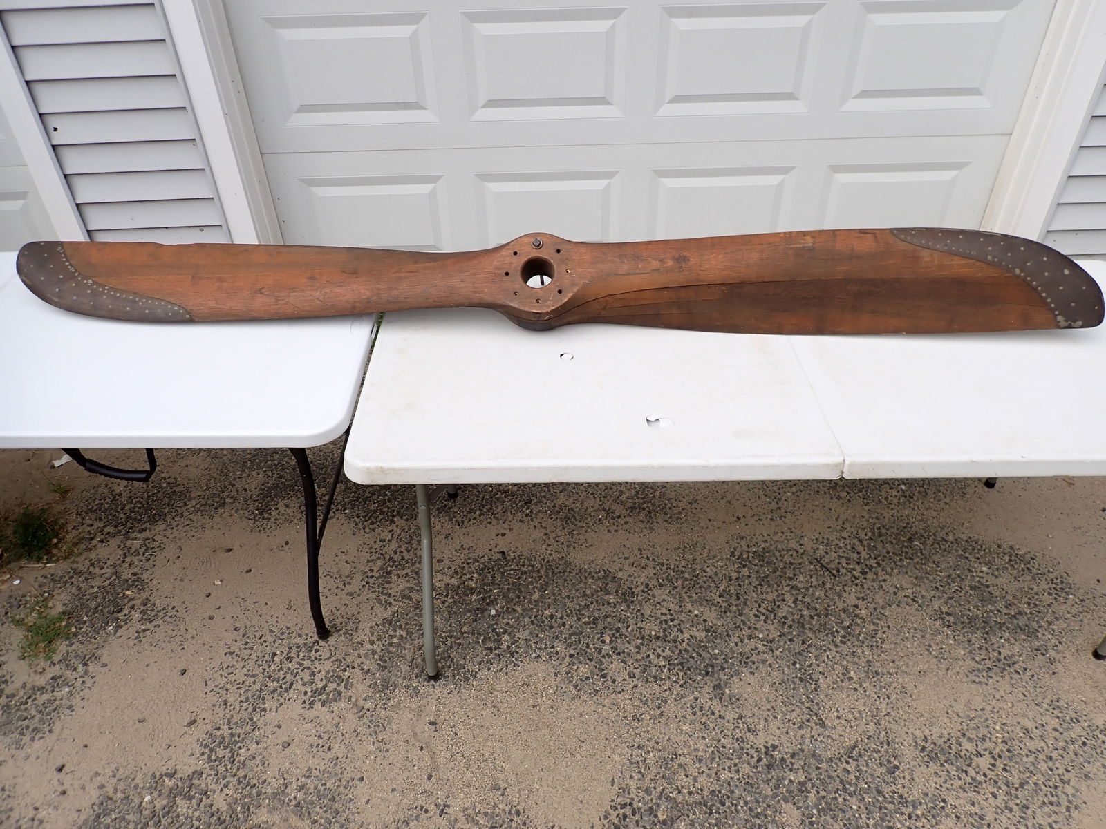 Antique Wooden Propellor - 8 Feet: Plaque says: S.C. Serial No. 4 2020 OX-5 Mfgr's Design No. Material Oak. 8 Ft. 0 In. Diameter Advance Per Turn 5 Ft. 3 In.. Has brass tips. Has some chipping and Delaminating in spots.