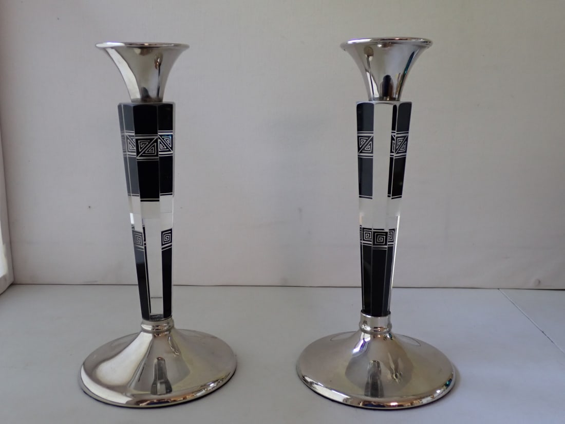Pair of Art Deco Glass Candlesticks: clear glass with black and frosted surfaces wheel cut with deco designs. The base and nozzles with silverplate overlay marked WMG A1. Attributed to Karl Palda. 4 7/8" diameter x 9 7/8" high. No cracks