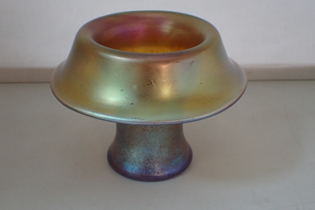 Art Glass Vase: iridescent gold glass with flaring rim. Faintly marked with oval acid-stamp in ground pontil, mark not readily identifiable in Hartmann. 5 1/2" diameter x 4" high. Ground pontil mark. No cracks or chi