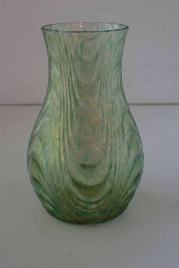 Art Glass Vase: gold iridescent clear and blue-green glass with swags and polished rim. Unmarked, attributed to Loetz Oceanik. 3 1/4" diameter x 5" high. No cracks. A couple of small chips at rim.
