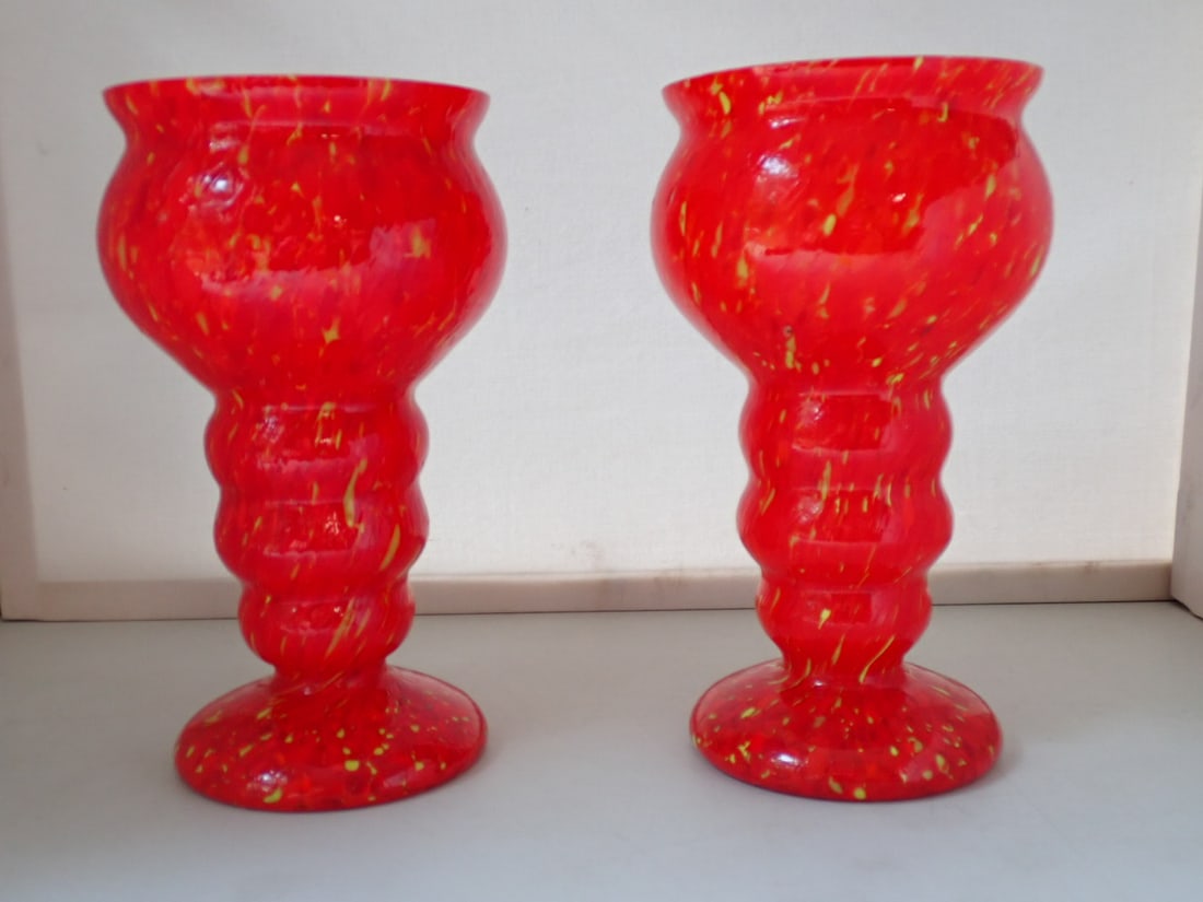 Pair of Czech Art Glass Vases: exterior in shades of red and yellow glass cased on a white glass body. Unmarked. 4 34" diameter x 8" high. No cracks or chips.