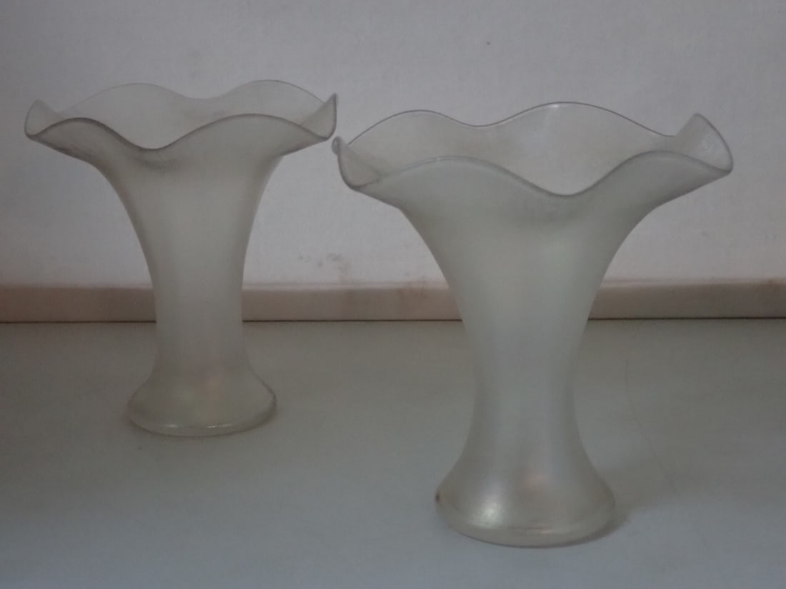 Pair of Steuben Verre de Soie Vases: iridescent light white glass with ruffled rim. Unmarked. 4 3/4" diameter x 4 7/8" high. Ground pontil mark. No cracks or chips.