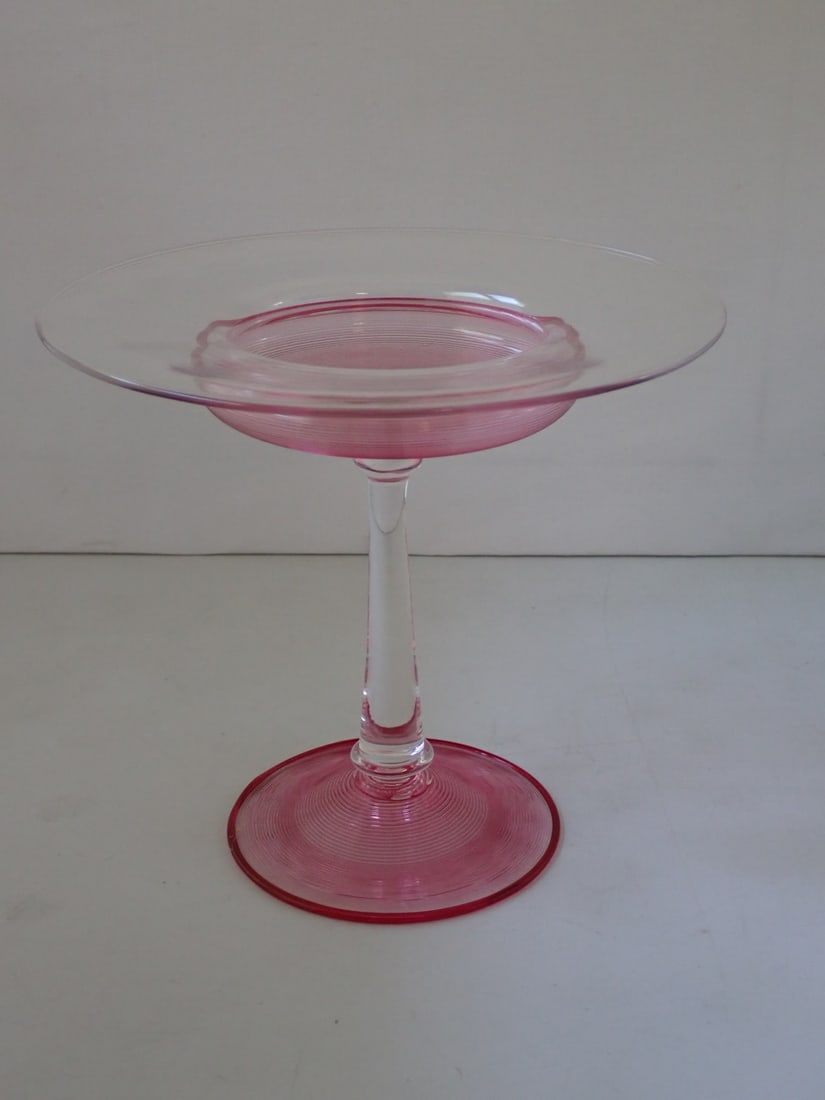 Art Glass Compote: red threading on a clear glass body. Unmarked. Attributed to Steuben. 7 7/8" diameter x 7 1/8" high. No cracks or chips. Light wear from use.