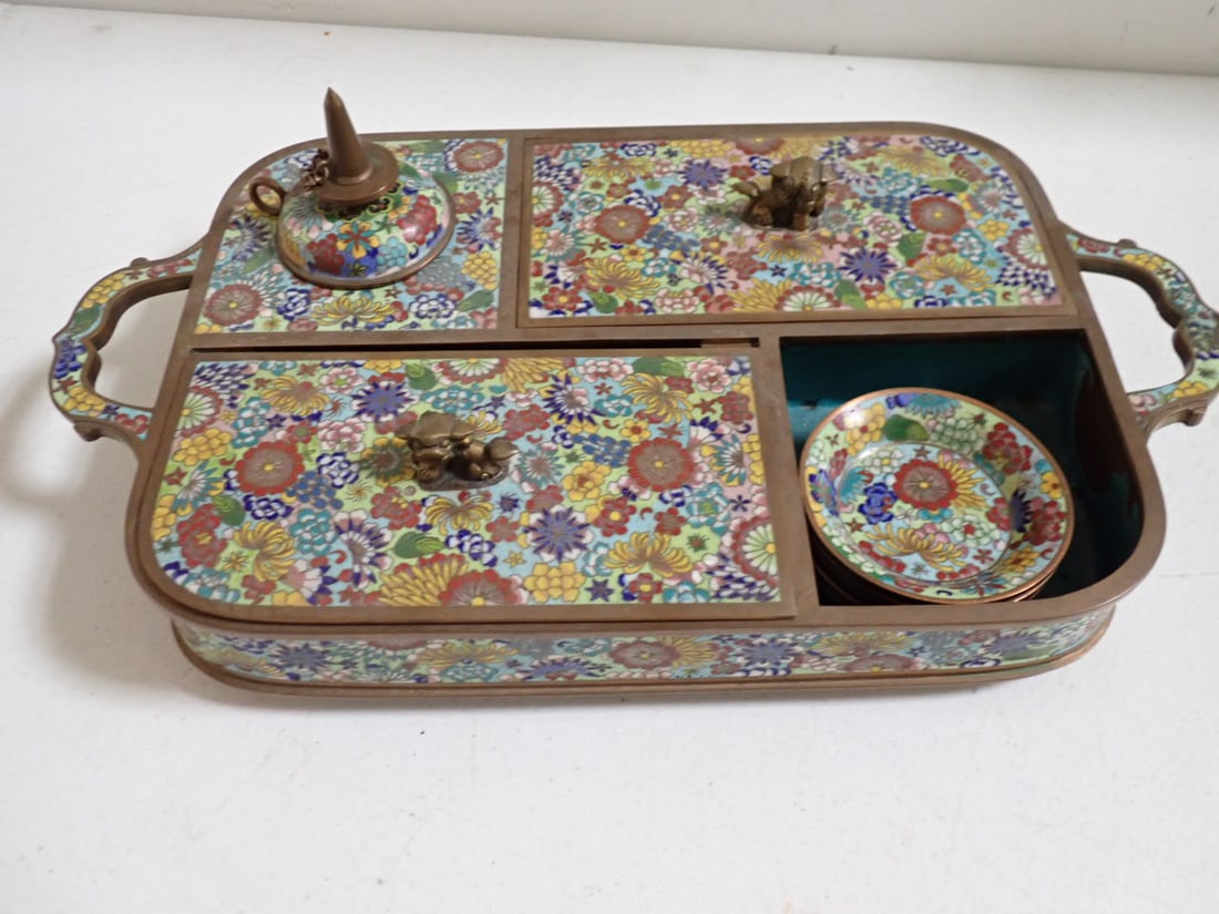 Chinese Cloisonné Opium Caddy: Chinese Cloisonné Opium Set with Burner, 5 Small Plates and 2 Storage Compartments with Foo Dog Handles. 14" Wide from Handle to Handle x 7". Good condition.