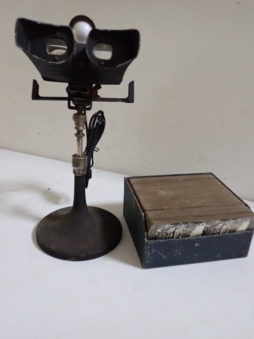 Metal Stero-optican Viewer & Stereoview Cards: Stereo Viewer industrial design with attached light and box of mostly foreign and some USA black and white stereo view cards