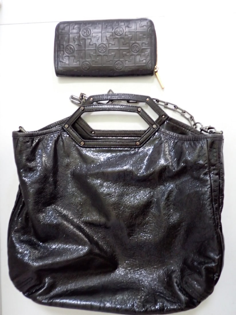 Tori Burch Handbag and Wallet: Handbag has a broken handle black Width 14" Height 12". Purse is embossed pattern leather wallet Width 8" Height 4"