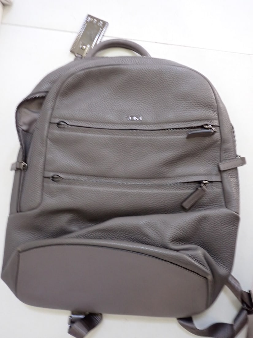Tumi Gray Leather Backpack: TUMI Gray leather backpack Width 12" Height 16" Good condition (see photos)