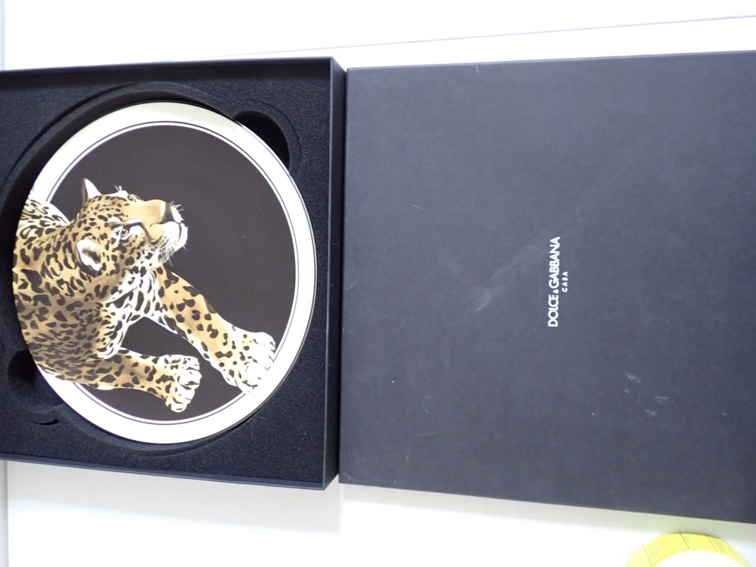 Dolce & Gabbana Casa mint in box Leopard round tray: 12" leopard print dish, mint in box. Backside has leopard, signed Dolce & Gabbana and a sticker TC0010 TCA44. UL005 $395 Set 2, light wear on box. Receipt for 394