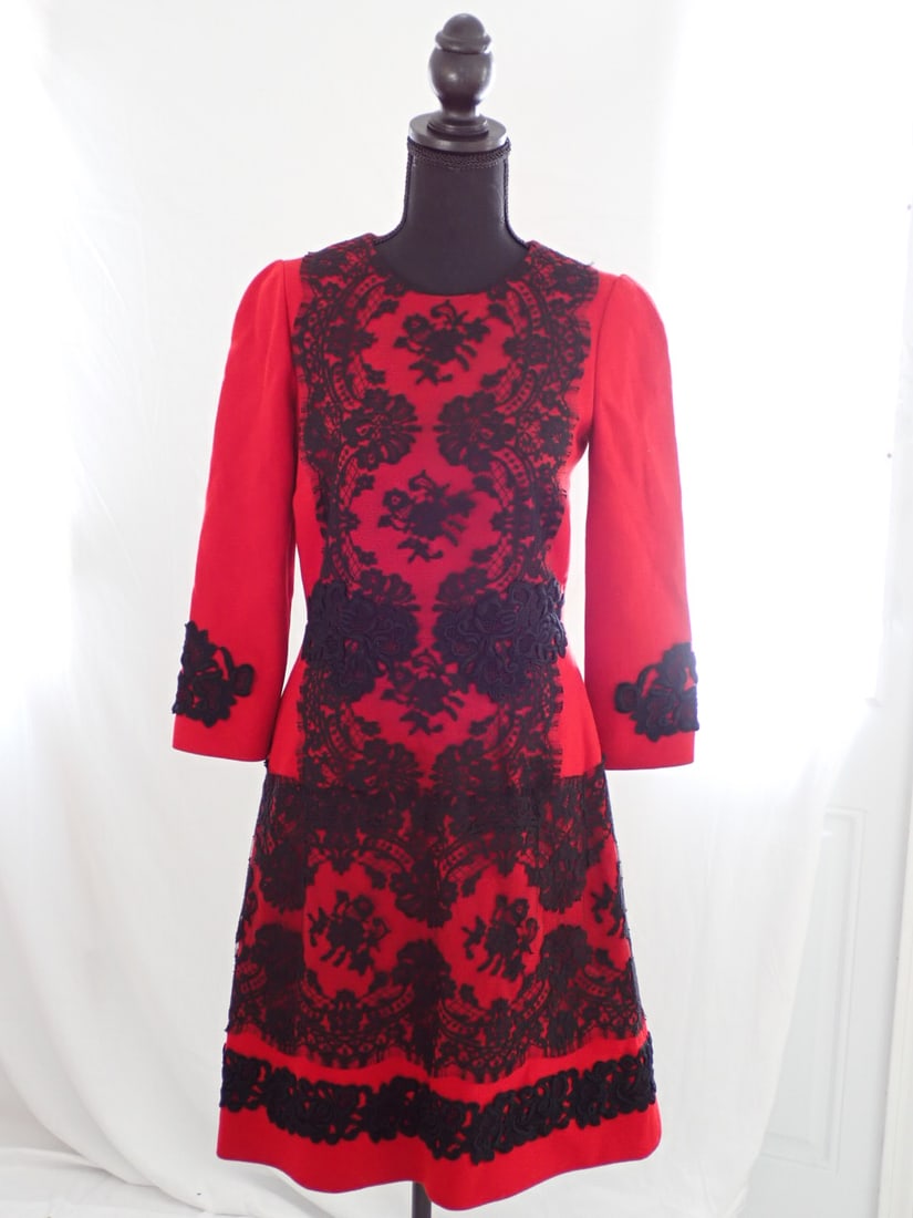 Dolce & Gabbana Red Wool Size Eur 40: Knee Length Red wool dress with lace overlay on dress knee length dress. Size EUR 40. Good Condition. Height to top of Mannequin is 68".