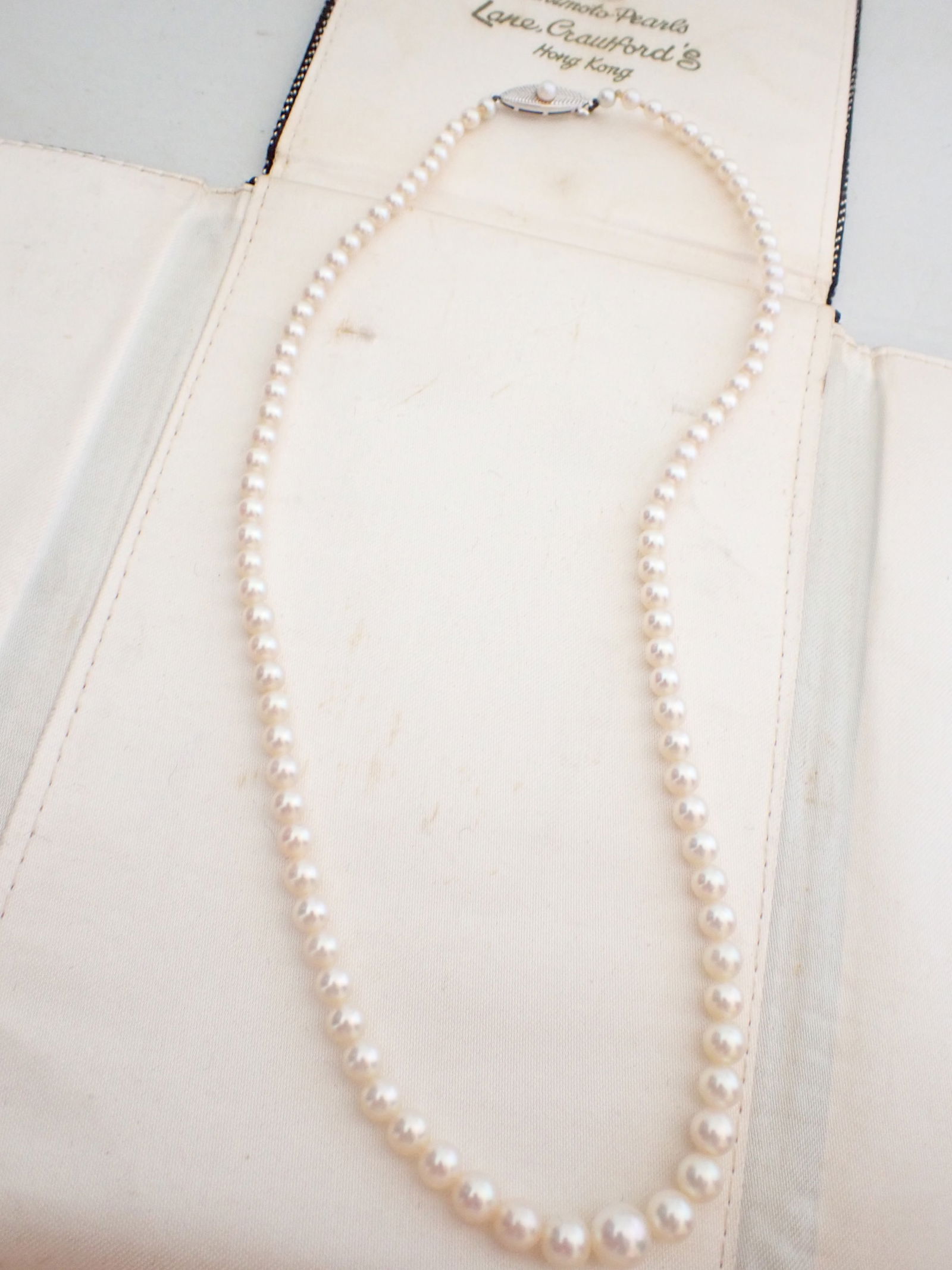 Signed "M" Mikimoto Graduated Strand of Pearls: One graduated strand of Mikimoto Pearls, unknotted, graduating in size from 7.25 mm to 3.6 mm. The pearls have high luster, minimal spotting, are well-matched and have a cream-rose body color. They ar