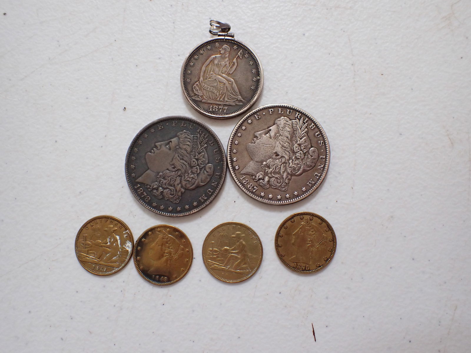 1877-S half dollar, Morgan Silver Dollars and 1849 Miners tokens/coins (1 of 12)