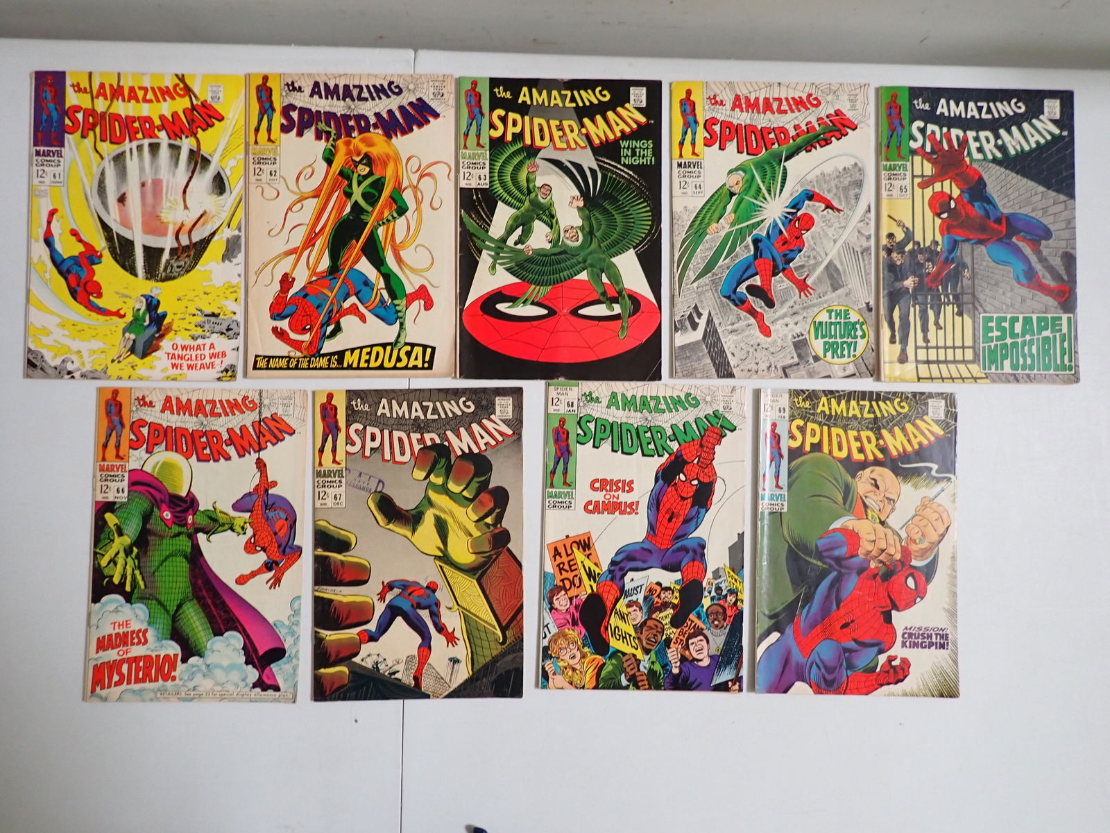 The Amazing Spider-Man 1968 & 1969 Marvel Comic Books # 61-69: Has # 66 Mysterio cover. Some edge wear and other wear.