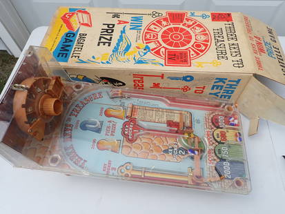Marx Three Keys To Treasure Bagatelle Game with Box: Has 8 plastic toy prizes in Wheel and 8 Marbles. Plastic has some cracking on the right side of game. has original box. Box has been written on in pen.