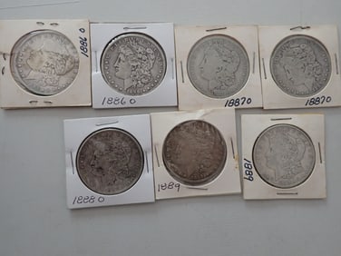 1886-O, 1887-O, 1880-O, 1889 Morgan Silver Dollars (7 coins)