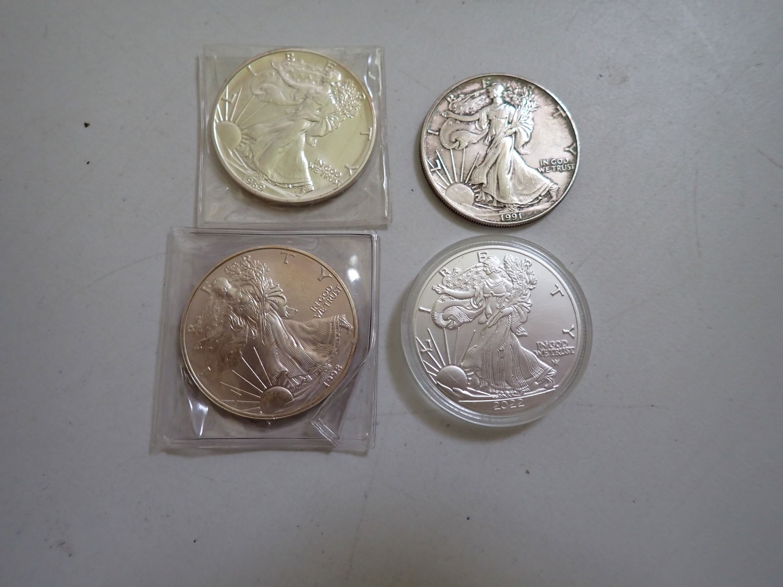 4 Silver Eagle Coins: 1989. 1991, 1998, and 2022 (1 of 9)