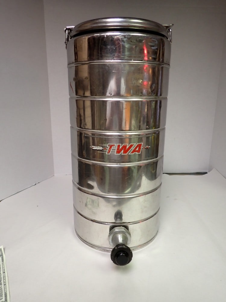 Vintage TWA coffee urn-metal: top and urn marked TWA finial is loose, some dents and light wear 17" x 8"