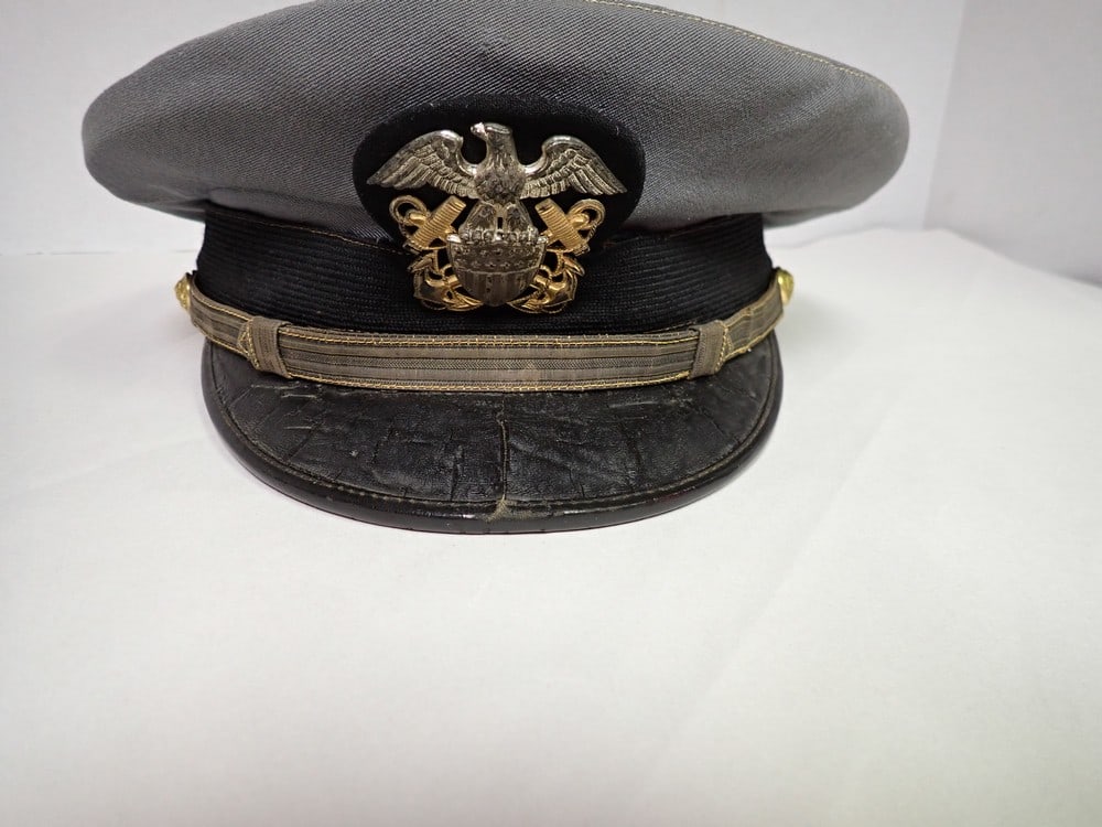 Navy Dress Hat: Has small hole in top of hat and some cracking on brim