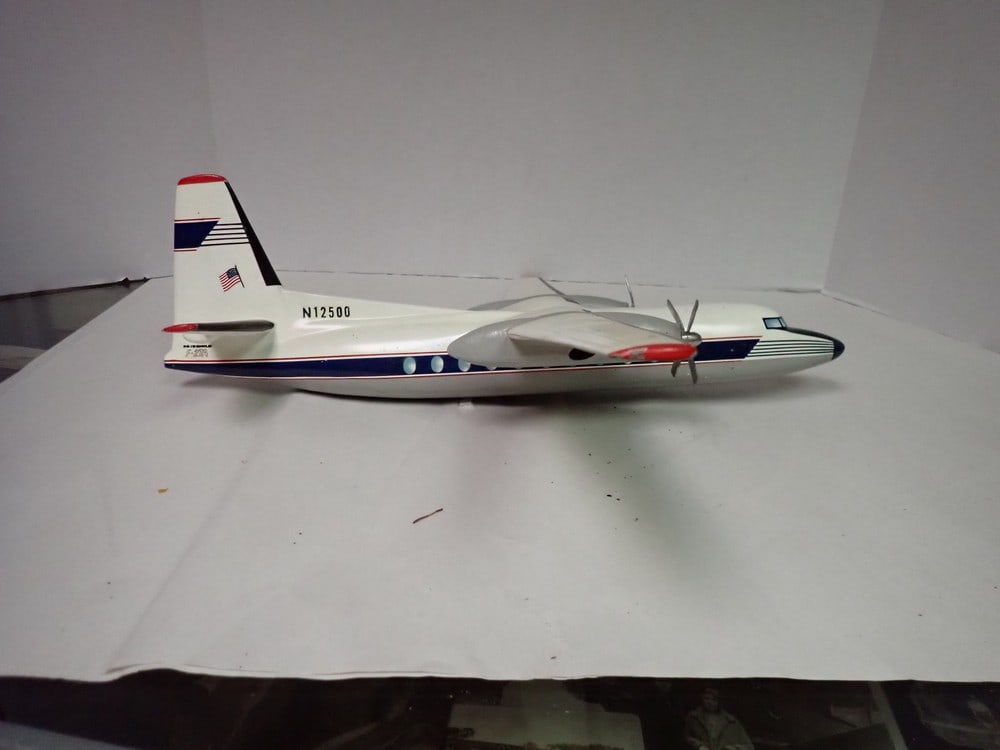 Fairchild F-27A Travel Agent Metal Airline Model: Little discoloration on wing. Overall good condition 22" wings 17 1/2" L no stand