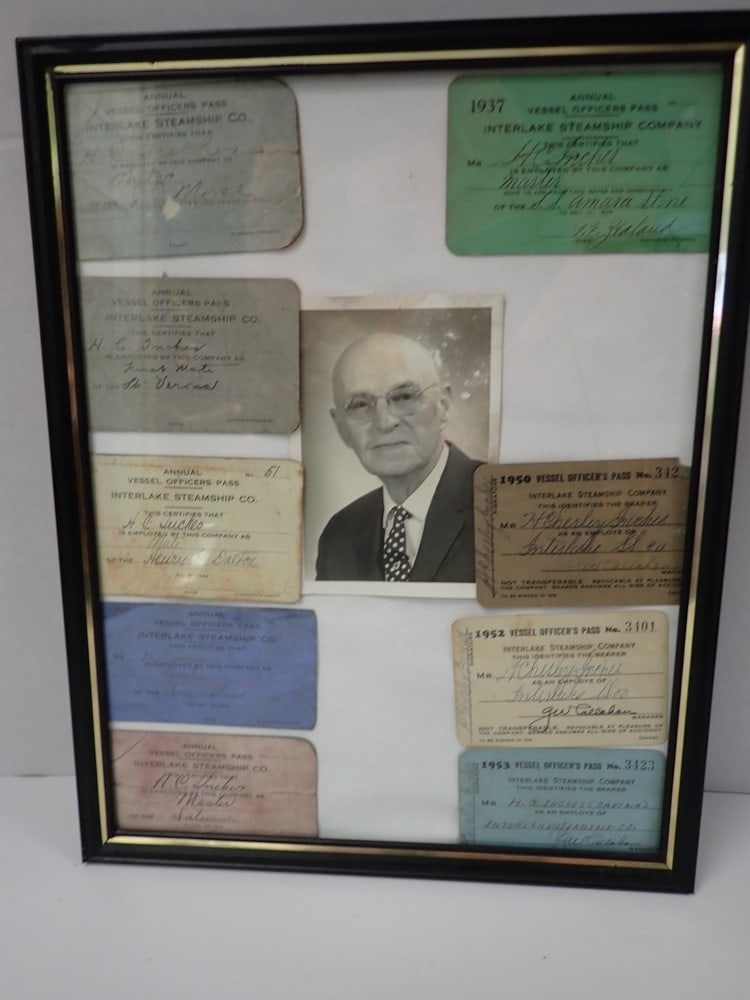 Interlake Steamship Company Captain's Vessel Passes: Assistant Vessel Officer Passes 1927-1953 for Capt. H. J. Inches with photo in frame. Photo has some paper loss, passes show wear 14"x 11"