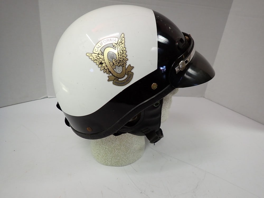 "California Highway Patrol" marked helme: Police Helmet With Visor Police Helmet with "California Highway Patrol" markings. Black and White helmet with visor with "CHP" Decals. Has some scuffing and crack in visor