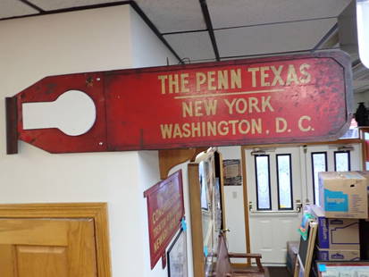 "The Penn Texas" Vintage Metal Railroad Sign: New York, Washington D.C. 50 1/2 L x 12". Has wooden replacement key hole some denting to frame on outside of sign. A little wear with some surface rust. Reverse side says "Penn Texas". St. Louis, Hou