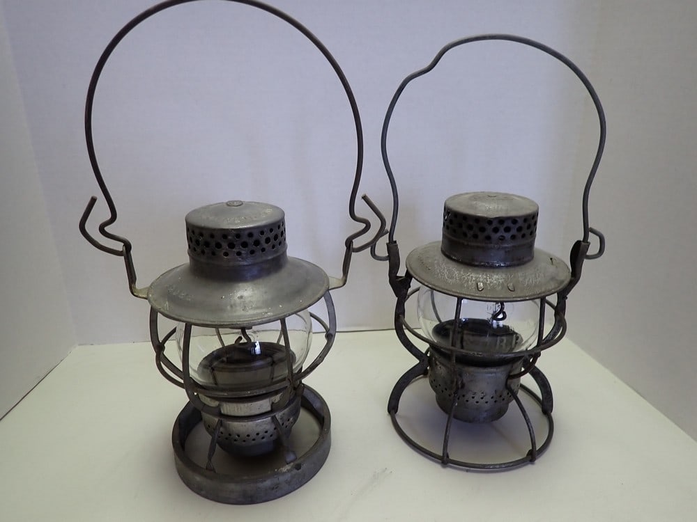 Pair of "B & O" Lanterns: One "Dietz" marked on lantern and stenciled on globe, surface rust. One "Dressel", light wear