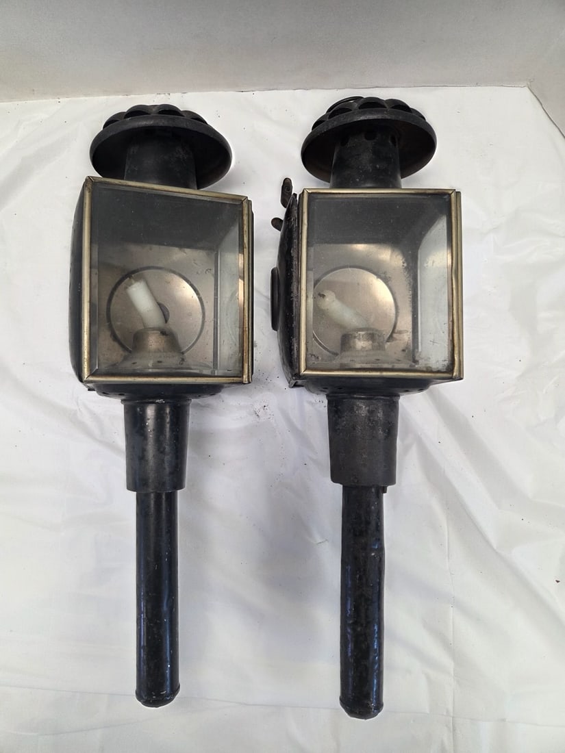 Pair of Carriage lamps and additional carriage lamp: Carriage lamps with red lenses. Some wear. 19" x 5 wide. Other lantern has rust and more wear. Has burner. Approximately 26" x 8" wide.
