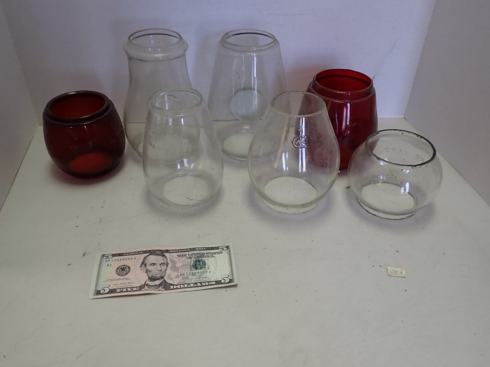 7 Railroad Globes, 5 Clear, 2 Red: A red one is cracked