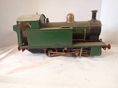 British Steam Engine Kit: Heavy metal engine, live steam. Engine appx 3 1/2" gauge. Has rust and the wheels are frozen. Detached valve.