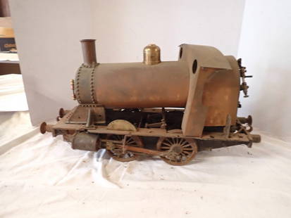 British Steam Engine Kit "City of Lonaconing": Heavy metal frame with copper and brass, rust, wheels frozen. Appx 5 3/4" gauge. 25 1/2" x 12 1/2". Missing back bumpers.