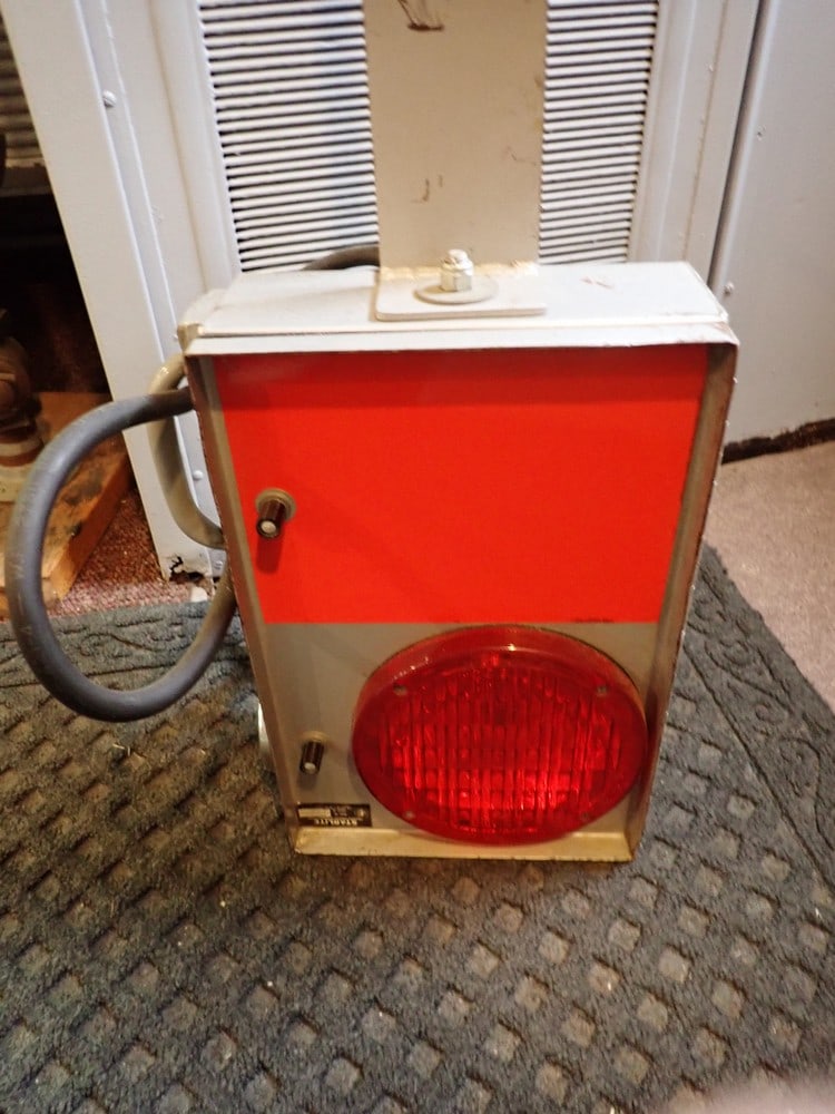 End of Train Warning Device: Marked "Starlite Transistorized Warning Light". Shows wear, some scuffing on lens.