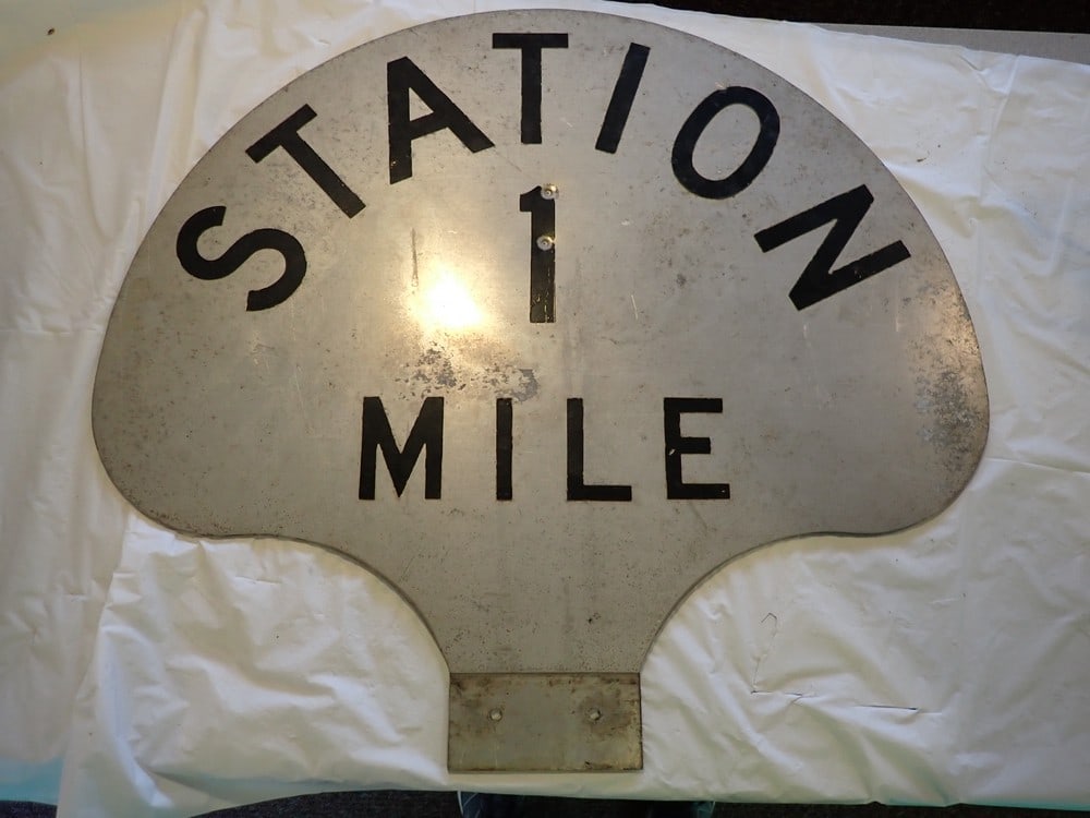 Station 1 Mile Sign: Aluminum, shows a little wear with scuffing & scratches23 1/4H x 26W