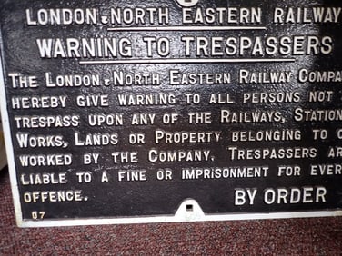 "London - North Eastern Railway" "No Trespassing" sign