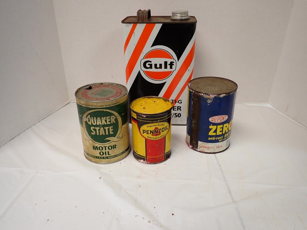 4 Vintage Oil Cans: Gulf" with arabic writing, Manf. in Saudi Arabia. 10" w/handle, 6 1/2W, 4"DQt. "Quaker State"Qt. "Dupont Zerone"1LB "Pennzoil