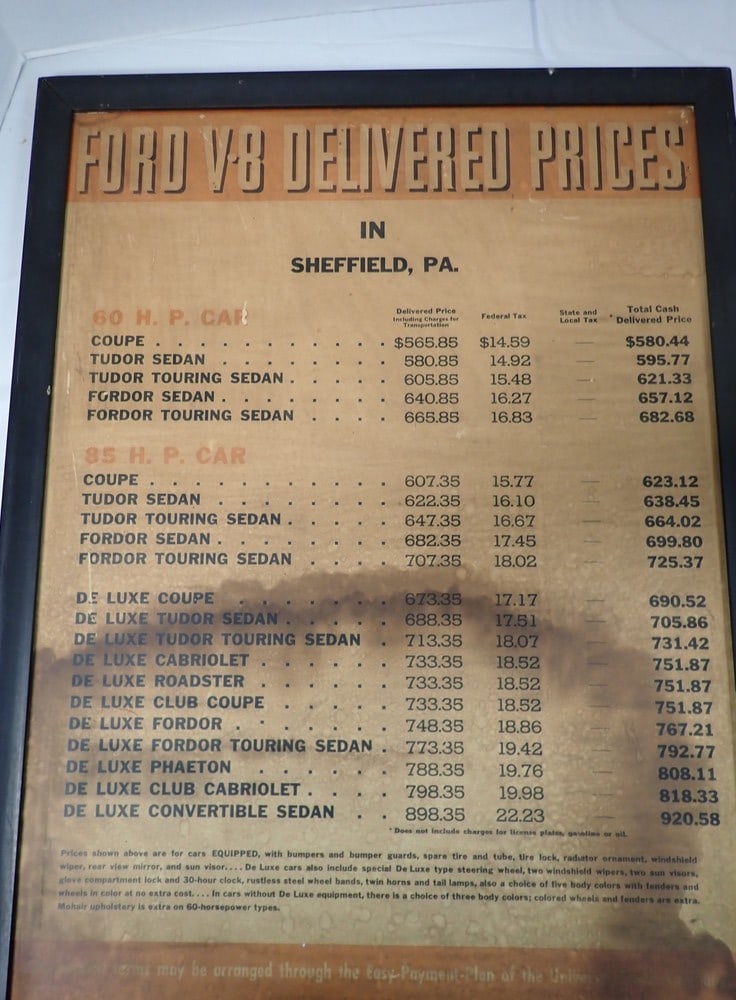 "Ford V-8 Delivered Prices" sign: "In Sheffield PA", aging & water staining, 25 1/2'H x 19 3/4W