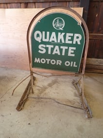 Quaker State Motor Oil sign on stand