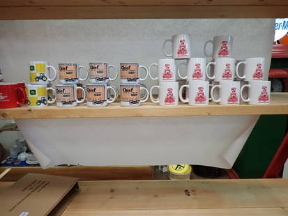 Harlansburg Station/Santa Fe Chief & other coffee cups: 19 Harlansburg Station, 11 Santa Fe Chief, 3x John Deere, and 2 Chevrolet Super Sport Roadster