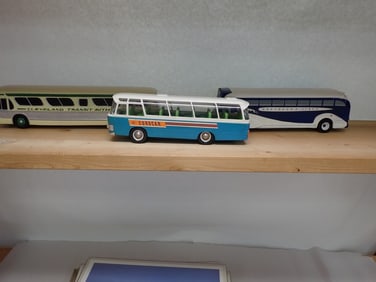 2 Plaster/wood Buses, and a Plastic Bus