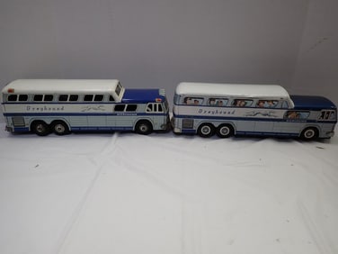 2 Greyhound tin Buses