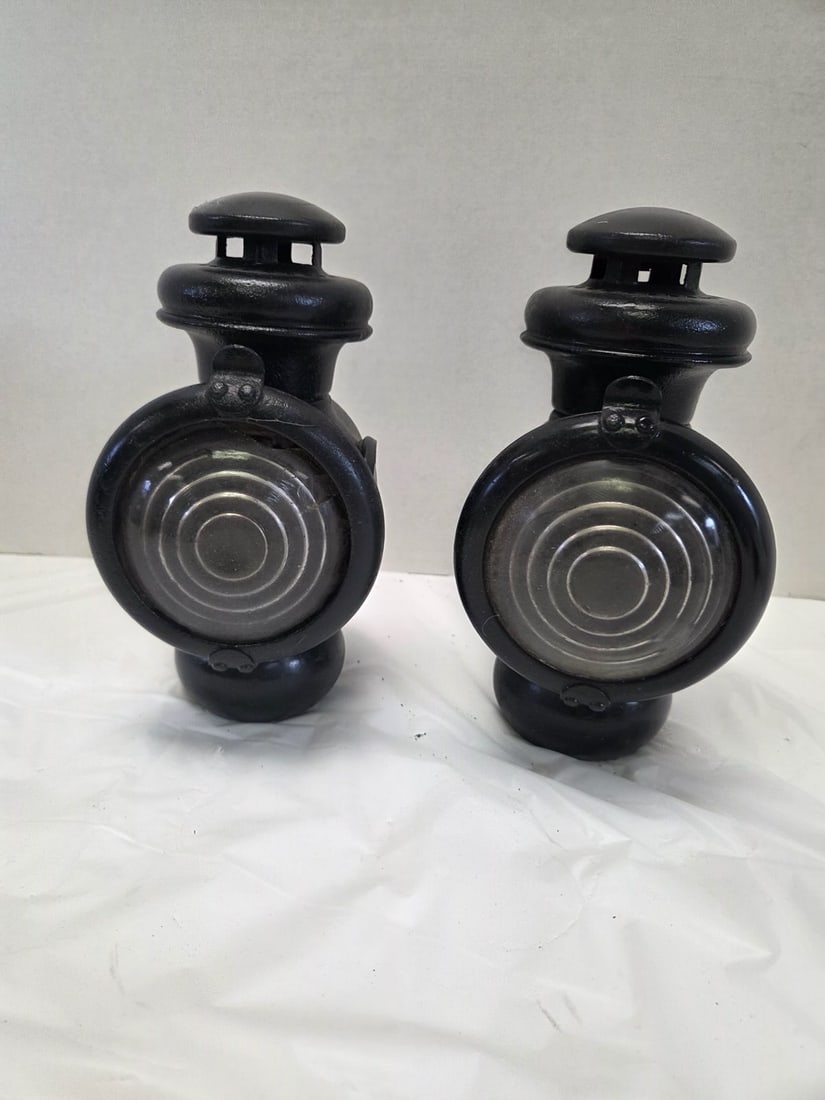 Antique automobile lamps: Have burners, one lens is chipped. Dia of lens 5". 9" high x 6" wide.