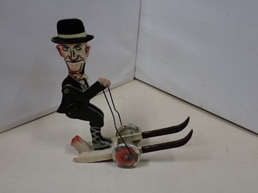 Stan Laurel Skiing wooden push toy
